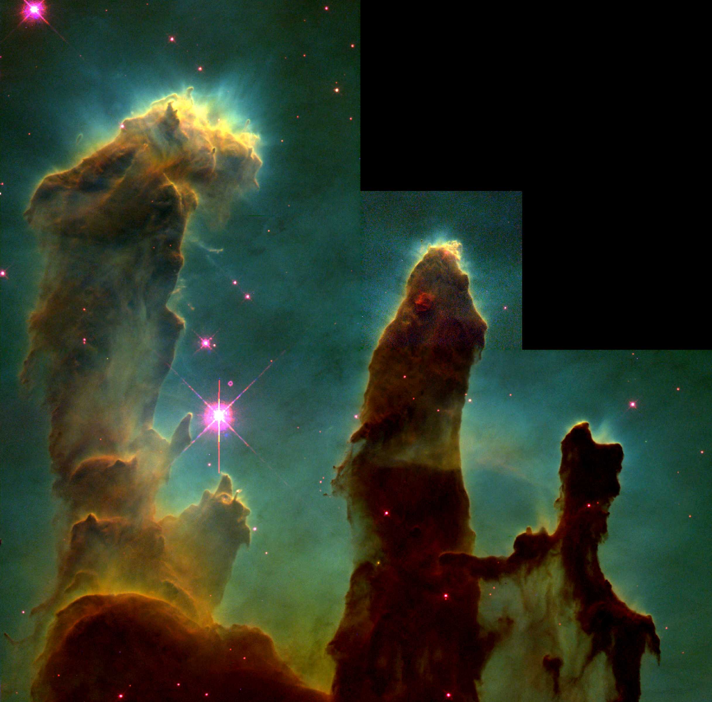 鷹星雲內部的氣體柱「創生之柱」，長度約一光年。頂部的雲氣正在蒸發，表示有新生的恆星正在發散恆星風，將物質吹散。